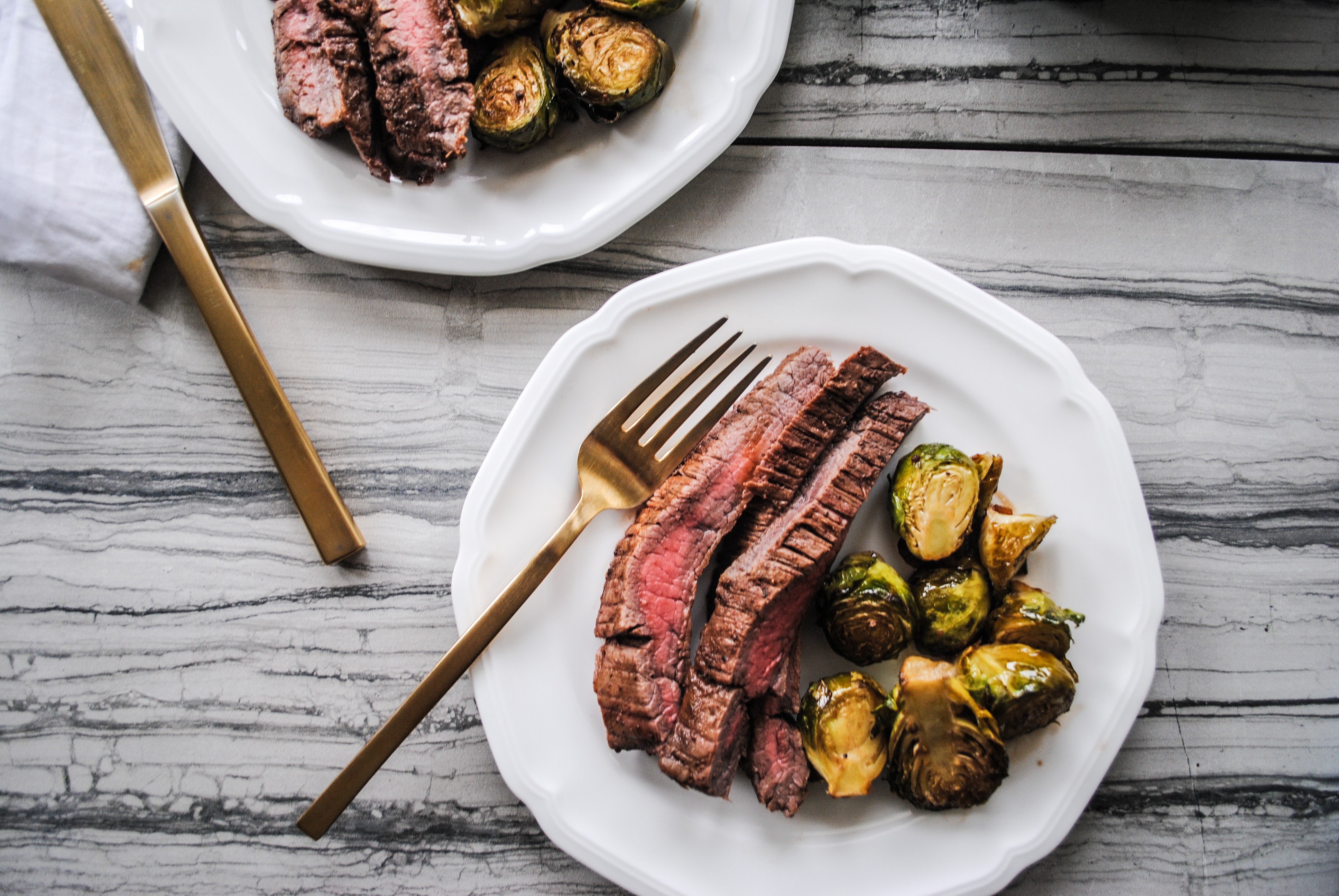 Food Blogger Jenny Meassick of Chocolate and Lace shares her recipe for Flank Steaks and Honey Balsamic Brussel Sprouts