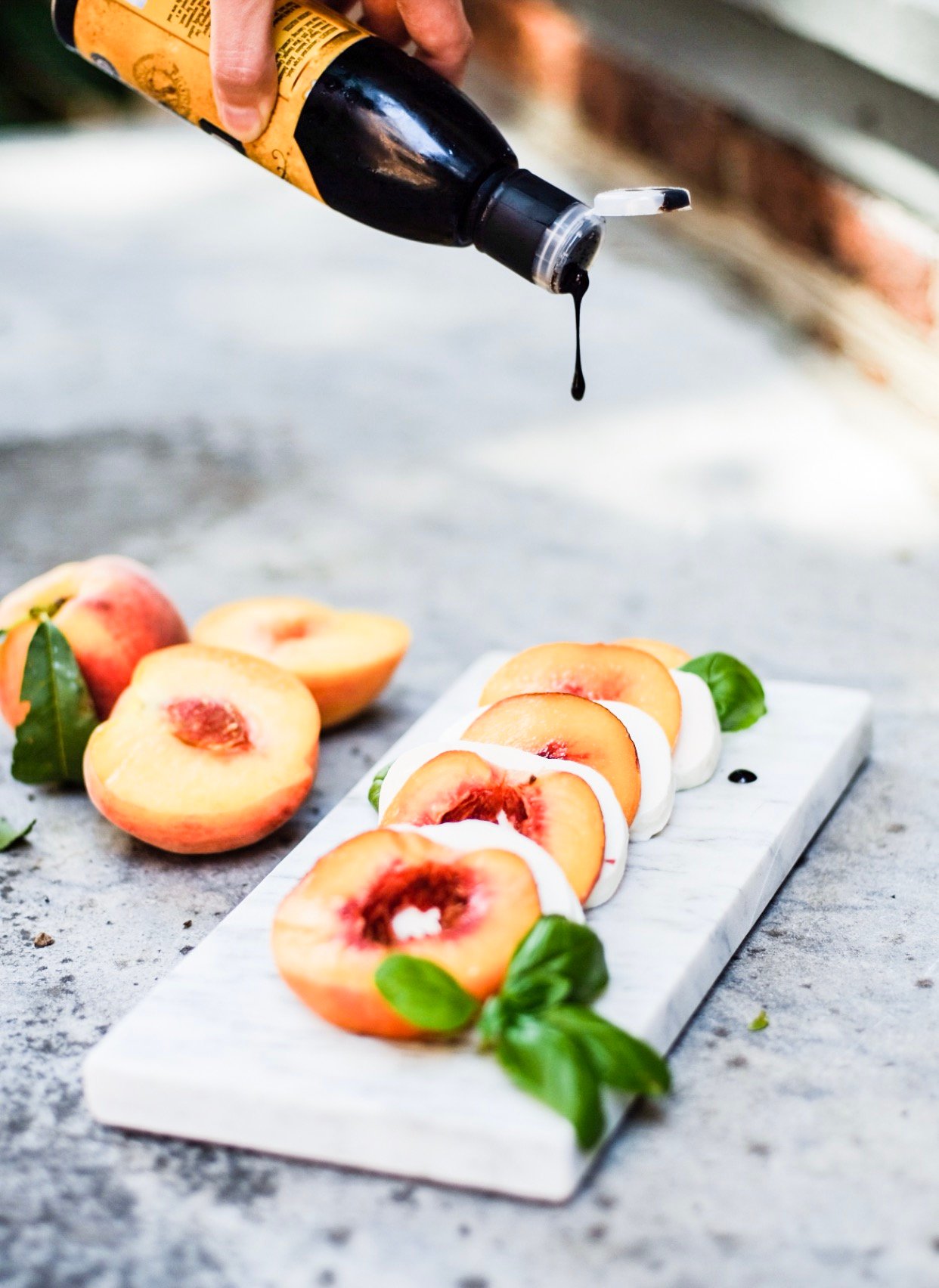 Lifestyle Blogger Chocolate and Lace shares her recipe for Peach Caprese Salad