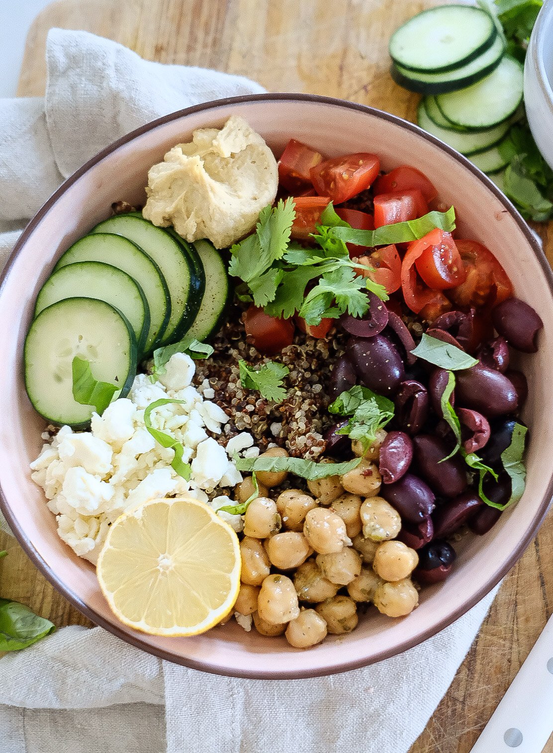 a brightly colored Greek Quinoa Bowl